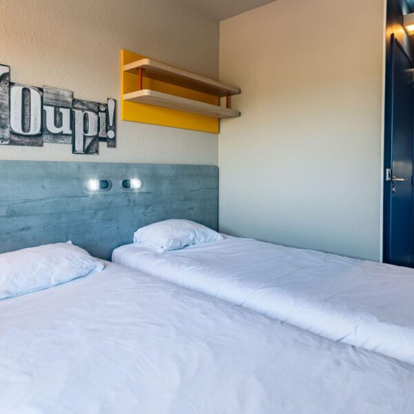 Chambre de l'Hôtel Ibis Budget Reims Thillois à Thillois dans la Marne