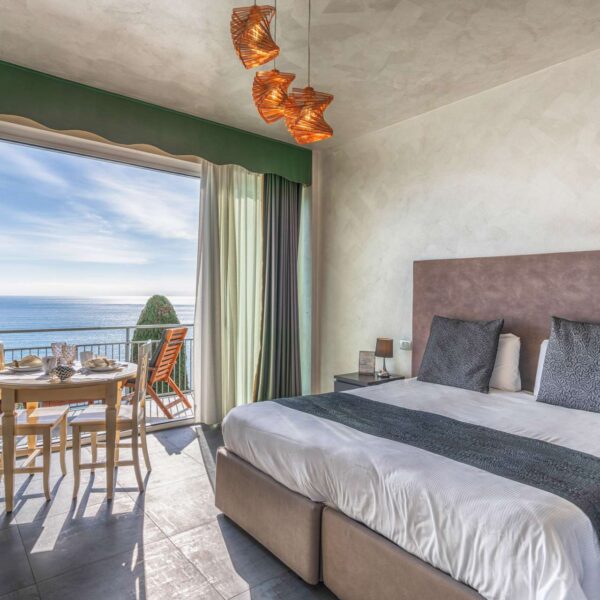 Lit double dans un appartement de Baba Residences à Alassio en Italie