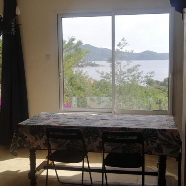 Dining room with sea view in a cottage in Corsica