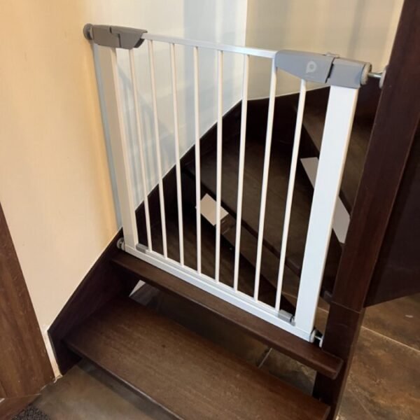 Staircase with baby safety gate at Cottage Jasper by Roof n'Woof in the Vosges in the Grand Est in Tholy